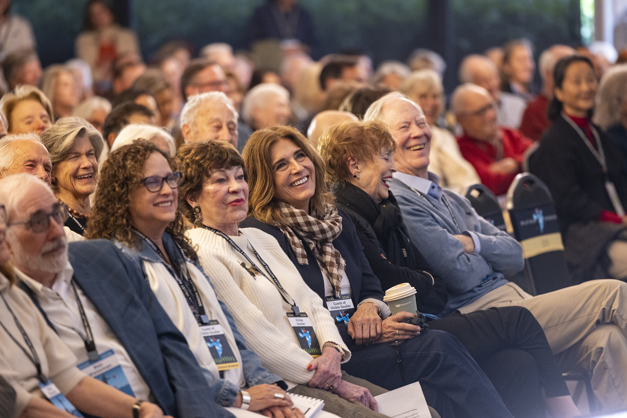 Festival attendees laughing during a session